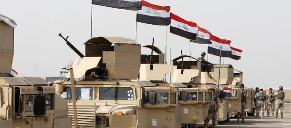 Iraqi security forces ride in vehicles travelling to Mosul to fight against militants of Islamic State at an Iraqi army base in Camp Taji in Baghdad, February 21, 2016 - Sputnik International