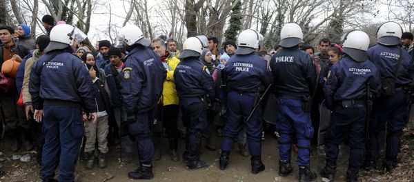Migrants are stopped by Greek riot police as they look for a way to cross the Greek-Macedonian border, near the village of Idomeni, Greece, March 14, 2016 Migrants are stopped by Greek riot police as they look for a way to cross the Greek-Macedonian border, near the village of Idomeni, Greece, March 14, 2016 - Sputnik International