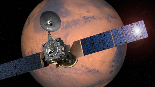 This image provided by the European Space Agency, ESA, shows an artist·s impression depicting the separation of the ExoMars 2016 entry, descent and landing demonstrator module, named Schiaparelli, from the Trace Gas Orbiter, and heading for Mars - Sputnik International