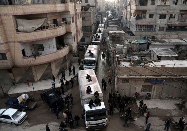 This file photo taken on February 23, 2016 shows a Red Crescent convoy carrying humanitarian aid arriveing in Kafr Batna, in the rebel-held Eastern Ghouta area, on the outskirts of the capital Damascus during an operation in cooperation with the UN to deliver aid to thousands of besieged Syrians This file photo taken on February 23, 2016 shows a Red Crescent convoy carrying humanitarian aid arriveing in Kafr Batna, in the rebel-held Eastern Ghouta area, on the outskirts of the capital Damascus during an operation in cooperation with the UN to deliver aid to thousands of besieged Syrians - Sputnik International