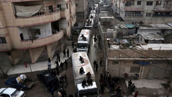 This file photo taken on February 23, 2016 shows a Red Crescent convoy carrying humanitarian aid arriveing in Kafr Batna, in the rebel-held Eastern Ghouta area, on the outskirts of the capital Damascus during an operation in cooperation with the UN to deliver aid to thousands of besieged Syrians This file photo taken on February 23, 2016 shows a Red Crescent convoy carrying humanitarian aid arriveing in Kafr Batna, in the rebel-held Eastern Ghouta area, on the outskirts of the capital Damascus during an operation in cooperation with the UN to deliver aid to thousands of besieged Syrians - Sputnik International