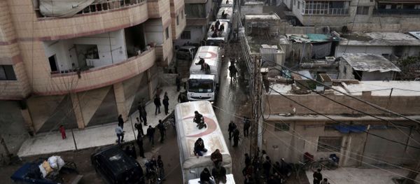 This file photo taken on February 23, 2016 shows a Red Crescent convoy carrying humanitarian aid arriveing in Kafr Batna, in the rebel-held Eastern Ghouta area, on the outskirts of the capital Damascus during an operation in cooperation with the UN to deliver aid to thousands of besieged Syrians - Sputnik International