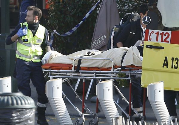 A victim is removed from the scene where shots were fired during a police search of a house in the suburb of Forest near Brussels, Belgium, March 15, 2016 A victim is removed from the scene where shots were fired during a police search of a house in the suburb of Forest near Brussels, Belgium, March 15, 2016 - Sputnik International