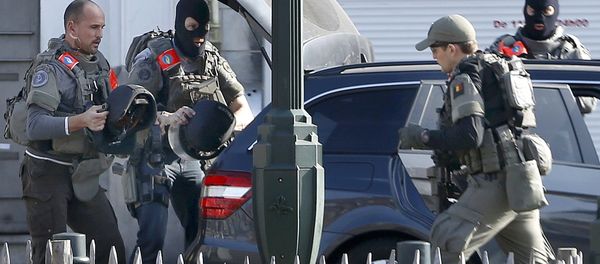 Police at the scene where shots were fired during a police search of a house in the suburb of Forest near Brussels, Belgium, March 15, 2016 Police at the scene where shots were fired during a police search of a house in the suburb of Forest near Brussels, Belgium, March 15, 2016 - Sputnik International