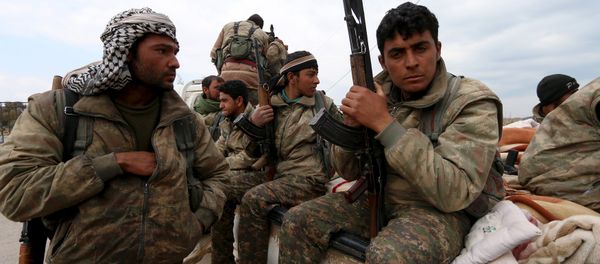 Kurdish People's Protection Units (YPG) fighters carry their weapons while riding on the back of a pick-up truck in Qamishli, Syria, March 11, 2016 Kurdish People's Protection Units (YPG) fighters carry their weapons while riding on the back of a pick-up truck in Qamishli, Syria, March 11, 2016 - Sputnik International