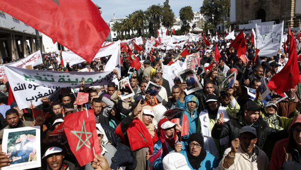 Protesters hold portraits of Morocco's King Mohammed VI and the Moroccan flag as they chant slogans during a rally, in Rabat, Morocco, Sunday, March 13, 2016. Morocco has accused U.N. Secretary-General Ban Ki-moon of abandoning neutrality, objectivity and impartiality during a recent visit to Western Saharan refugee camps in southern Algeria Protesters hold portraits of Morocco's King Mohammed VI and the Moroccan flag as they chant slogans during a rally, in Rabat, Morocco, Sunday, March 13, 2016. Morocco has accused U.N. Secretary-General Ban Ki-moon of abandoning neutrality, objectivity and impartiality during a recent visit to Western Saharan refugee camps in southern Algeria - Sputnik International