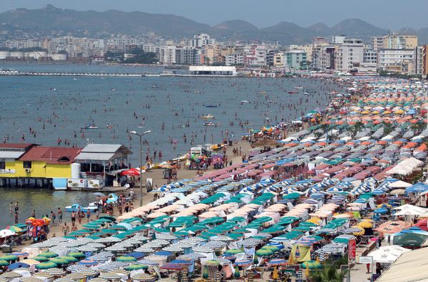 A photo taken on July 23, 2015 shows a general view of a crowded beach of the Adriatic Sea in the Albanian city of Durres A photo taken on July 23, 2015 shows a general view of a crowded beach of the Adriatic Sea in the Albanian city of Durres - Sputnik International