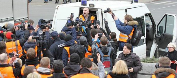 The arrest of journalist Graham Phillips at SS veterans' march in Riga, Latvia. March 16, 2016. - Sputnik International