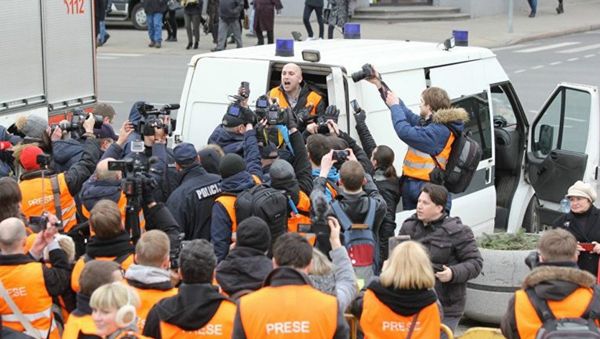 The arrest of journalist Graham Phillips at SS veterans' march in Riga, Latvia. March 16, 2016. - Sputnik International