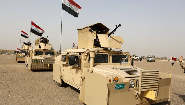 Iraqi security forces ride in vehicles travelling to Mosul to fight against militants of Islamic State at an Iraqi army base in Camp Taji in Baghdad, February 21, 2016 - Sputnik International