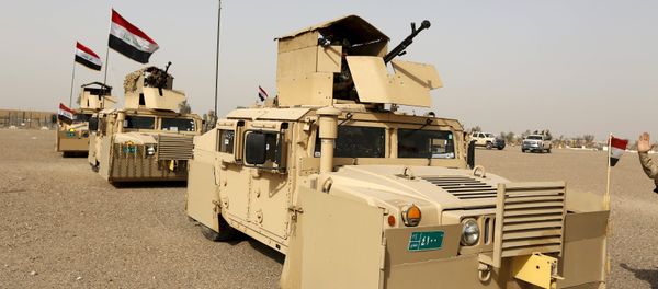 Iraqi security forces ride in vehicles travelling to Mosul to fight against militants of Islamic State at an Iraqi army base in Camp Taji in Baghdad, February 21, 2016 Iraqi security forces ride in vehicles travelling to Mosul to fight against militants of Islamic State at an Iraqi army base in Camp Taji in Baghdad, February 21, 2016 - Sputnik International