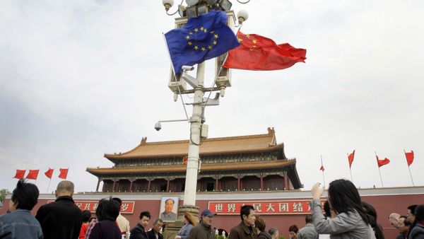 Visitors walk under flags of European Union and China in front of The Tiananmen Gate in Beijing (File) Visitors walk under flags of European Union and China in front of The Tiananmen Gate in Beijing (File) - Sputnik International