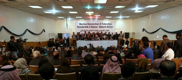 Delegates take part in a conference where they announced a federal system in Syria's Kurdish-controlled northern regions, in the town of Rmeilan, Hasaka province, Syria - Sputnik International