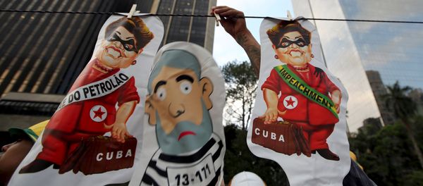 A vendor displays inflatable dolls of Brazilian President Dilma Rousseff and the 'Pixuleco' of Brazil's former President Luiz Inacio Lula da Silva during a protest against Rousseff's appointment of Lula da Silva as her chief of staff at Paulista avenue in Sao Paulo, Brazil, March 17, 2016. A vendor displays inflatable dolls of Brazilian President Dilma Rousseff and the 'Pixuleco' of Brazil's former President Luiz Inacio Lula da Silva during a protest against Rousseff's appointment of Lula da Silva as her chief of staff at Paulista avenue in Sao Paulo, Brazil, March 17, 2016. - Sputnik International