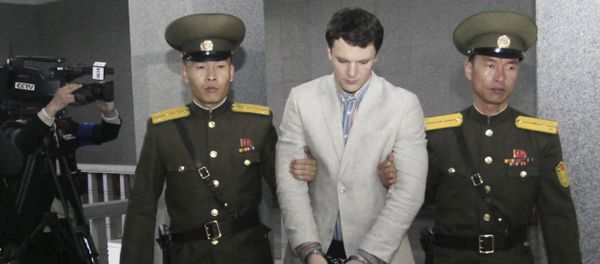 American student Otto Warmbier, center, is escorted at the Supreme Court in Pyongyang. American student Otto Warmbier, center, is escorted at the Supreme Court in Pyongyang. - Sputnik International
