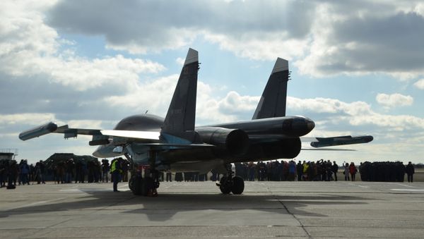 Pilots of Russian Su-34 bomber jets from Syria welcomed at an airbase in Russia's Voronezh region. - Sputnik International