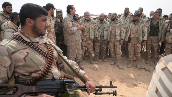 Fighters of the Desert Falcons self-defense unit during re-stationing of troops near the Syrian city of Palmyra. Fighters of the Desert Falcons self-defense unit during re-stationing of troops near the Syrian city of Palmyra. - Sputnik International