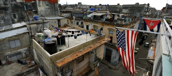 US and Cuban flags are seen on a balcony in Havana, Cuba March 19, 2016. - Sputnik International
