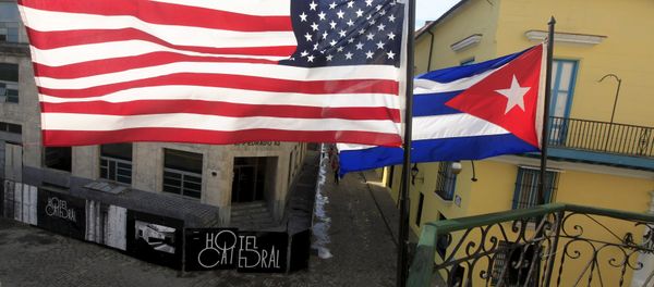 US and Cuban flags are seen on the balcony of a restaurant in downtown Havana, Cuba March 19, 2016. US and Cuban flags are seen on the balcony of a restaurant in downtown Havana, Cuba March 19, 2016. - Sputnik International