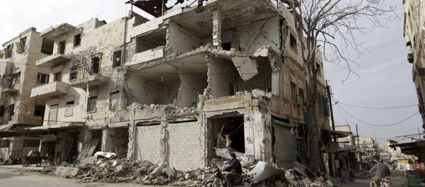 A man rides a motorbike near damaged buildings in the town of Marat Numan in Idlib province, Syria, March 19, 2016 A man rides a motorbike near damaged buildings in the town of Marat Numan in Idlib province, Syria, March 19, 2016 - Sputnik International