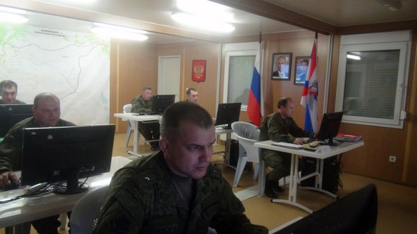 Russian soldiers work behind their screens on March 17, 2016 in Russia's reconciliation center as they monitor the truce in Syria at the Hmeimim air base in the Latakia province Russian soldiers work behind their screens on March 17, 2016 in Russia's reconciliation center as they monitor the truce in Syria at the Hmeimim air base in the Latakia province - Sputnik International