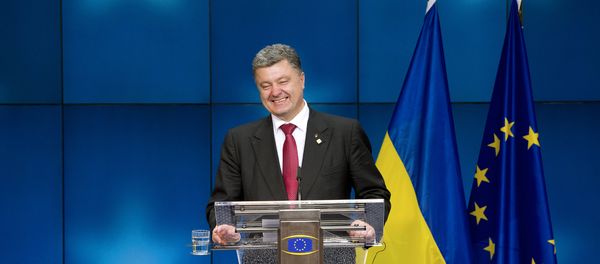 Ukraine President Petro Poroshenko smiles as he gives a press conference on the sidelines of of the EU Council in Brussels (File) Ukraine President Petro Poroshenko smiles as he gives a press conference on the sidelines of of the EU Council in Brussels (File) - Sputnik International