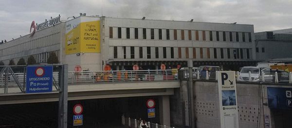 In this image provided by Daniela Schwarzer, smoke is seen at Brussels airport in Brussels, Belgium, after explosions were heard Tuesday, March 22, 2016 In this image provided by Daniela Schwarzer, smoke is seen at Brussels airport in Brussels, Belgium, after explosions were heard Tuesday, March 22, 2016 - Sputnik International