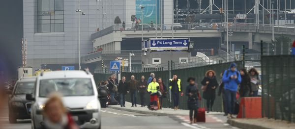 People leave the scene of explosions at Zaventem airport near Brussels, Belgium, March 22, 2016 - Sputnik International