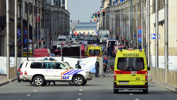 Policemen stand guard at the entrance of a security perimeter set near Maalbeek metro station, on March 22, 2016 in Brussels Policemen stand guard at the entrance of a security perimeter set near Maalbeek metro station, on March 22, 2016 in Brussels - Sputnik International