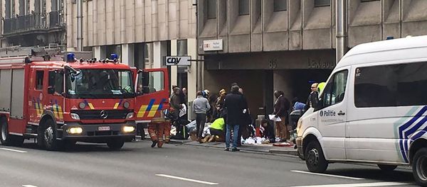 Emergency services take care of wounded people outside the Maalbeek metro station in Brussels on March 21, 2016 after a blast at this station located near the EU institutions Emergency services take care of wounded people outside the Maalbeek metro station in Brussels on March 21, 2016 after a blast at this station located near the EU institutions - Sputnik International