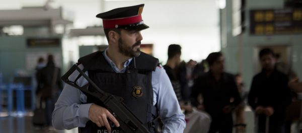 A police officer guards a terminal of the airport during tighter security measures in Barcelona, Spain, Tuesday, March 22, 2016 A police officer guards a terminal of the airport during tighter security measures in Barcelona, Spain, Tuesday, March 22, 2016 - Sputnik International