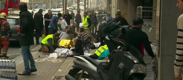 Rescue workers treat victims outside the Maelbeek metro station after a blast, in Brussels, Belgium, in this image taken from a March 22, 2016 video - Sputnik International