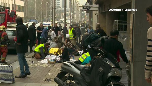Rescue workers treat victims outside the Maelbeek metro station after a blast, in Brussels, Belgium, in this image taken from a March 22, 2016 video Rescue workers treat victims outside the Maelbeek metro station after a blast, in Brussels, Belgium, in this image taken from a March 22, 2016 video - Sputnik International