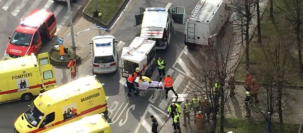 Rescue teams evacuate wounded people outside the Maalbeek metro station in Brussels on March 22, 2016 after a blast at this station located near the EU institutions Rescue teams evacuate wounded people outside the Maalbeek metro station in Brussels on March 22, 2016 after a blast at this station located near the EU institutions - Sputnik International
