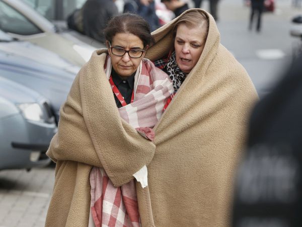 People wrapped in blankets leave the scene of explosions at Zaventem airport near Brussels, Belgium, March 22, 2016. People wrapped in blankets leave the scene of explosions at Zaventem airport near Brussels, Belgium, March 22, 2016. - Sputnik International