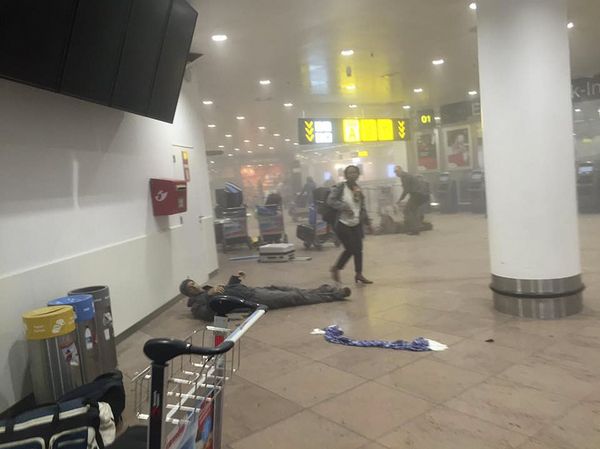 An injured man lies at the scene of explosions at Zaventem airport near Brussels, Belgium, March 22, 2016 - Sputnik International