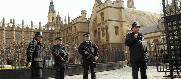 Armed police stand on guard at the Houses of Parliament in London, Britain March 22, 2016. Britain's Prime Minister David Cameron said he would chair a crisis response meeting following explosions in Brussels on Tuesday - Sputnik International