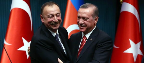 Azerbaijani President Ilham Aliyev (L) and Turkish President Recep Tayyip Erdogan (R) huging after signing bilateral agreements following the 5th Turkey-Azerbaijan High Level Strategic Cooperation Council meeting at the Presidential Complex in Ankara Azerbaijani President Ilham Aliyev (L) and Turkish President Recep Tayyip Erdogan (R) huging after signing bilateral agreements following the 5th Turkey-Azerbaijan High Level Strategic Cooperation Council meeting at the Presidential Complex in Ankara - Sputnik International