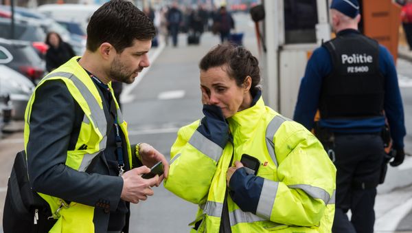 People react outside Brussels airport after explosions rocked the facility in Brussels, Belgium Tuesday March 22, 2016 People react outside Brussels airport after explosions rocked the facility in Brussels, Belgium Tuesday March 22, 2016 - Sputnik International