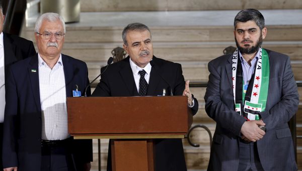 Asaad Al-Zoubi attends a news conference next to Mohamed Alloush of the Jaysh al Islam and George Sabra members of the High Negotiations Committee (HNC) after a meeeting with U.N. mediator Staffan de Mistura during Syria peace talks at the United Nations in Geneva, Switzerland, March 22, 2016 - Sputnik International