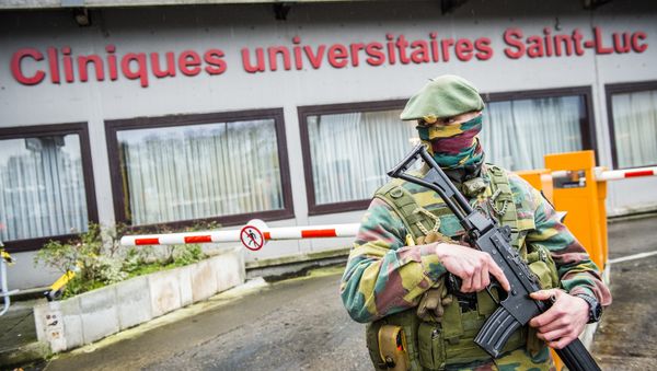 A soldier patrols in front of the hospital Cliniques Universitaires Saint-Luc in Brussels (File) A soldier patrols in front of the hospital Cliniques Universitaires Saint-Luc in Brussels (File) - Sputnik International