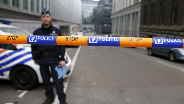 A Belgian police officer stands guard near the federal police headquarters in Brussels, March 19, 2016, after Salah Abdeslam, the most-wanted fugitive from November's Paris attacks, was arrested after a shootout with police in Brussels on Friday. A Belgian police officer stands guard near the federal police headquarters in Brussels, March 19, 2016, after Salah Abdeslam, the most-wanted fugitive from November's Paris attacks, was arrested after a shootout with police in Brussels on Friday. - Sputnik International