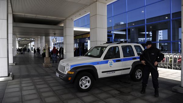 A police officer stands outside the Athens Eleftherios Venizelos International Airport near Athens, Greece, March 22, 2016 A police officer stands outside the Athens Eleftherios Venizelos International Airport near Athens, Greece, March 22, 2016 - Sputnik International