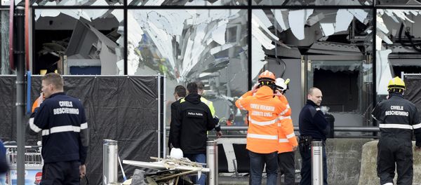 Broken windows of the terminal at Brussels national airport are seen during a ceremony following bomb attacks in Brussels metro and Belgium's National airport of Zaventem, Belgium, March 23, 2016 Broken windows of the terminal at Brussels national airport are seen during a ceremony following bomb attacks in Brussels metro and Belgium's National airport of Zaventem, Belgium, March 23, 2016 - Sputnik International