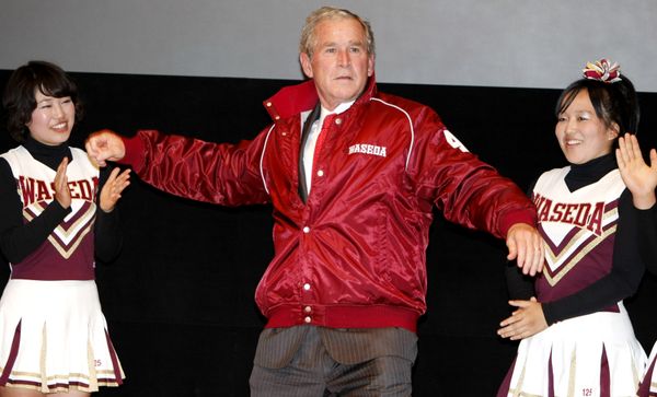 Former U.S. President George W. Bush, center, shows a pitching form, wearing a university's baseball jacket, during his visit to Waseda University in Tokyo, Japan. Former U.S. President George W. Bush, center, shows a pitching form, wearing a university's baseball jacket, during his visit to Waseda University in Tokyo, Japan. - Sputnik International