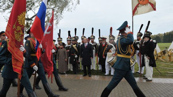 Russian President Vladimir Putin, background center, watching the march of the company of honor guards during celebrations of the 200th anniversary of the Battle of Borodino at the State Borodino Military and Historical Museum-Reserve, September 2, 2012. - Sputnik International
