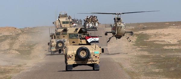 In this Wednesday, March 9, 2016 photo, Iraqi Defense Minister Khaled al-Obeidi's convoy tours the front line in their fight against Islamic State group militants in the Samarra desert, on the border between Anbar and Salahuddin provinces, Iraq In this Wednesday, March 9, 2016 photo, Iraqi Defense Minister Khaled al-Obeidi's convoy tours the front line in their fight against Islamic State group militants in the Samarra desert, on the border between Anbar and Salahuddin provinces, Iraq - Sputnik International
