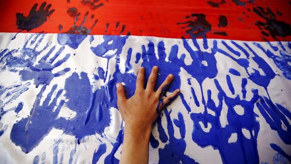 Hand prints on a Yemeni flag during a gathering held by Houthi loyalists against Saudi-led air strikes in Yemen's capital Sanaa March 9, 2016. Hand prints on a Yemeni flag during a gathering held by Houthi loyalists against Saudi-led air strikes in Yemen's capital Sanaa March 9, 2016. - Sputnik International