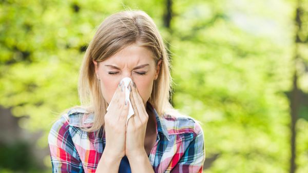 Woman with allergy symptom blowing nose. Woman with allergy symptom blowing nose. - Sputnik International