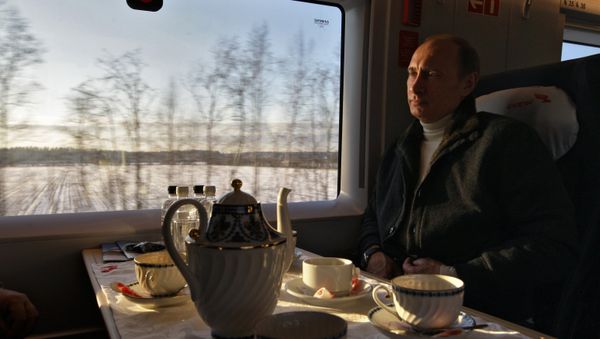 Vladimir Putin taking a trip on the newly launched Sapsan high-speed train linking Moscow and St. Petersburg, December 19, 2009. Vladimir Putin taking a trip on the newly launched Sapsan high-speed train linking Moscow and St. Petersburg, December 19, 2009. - Sputnik International